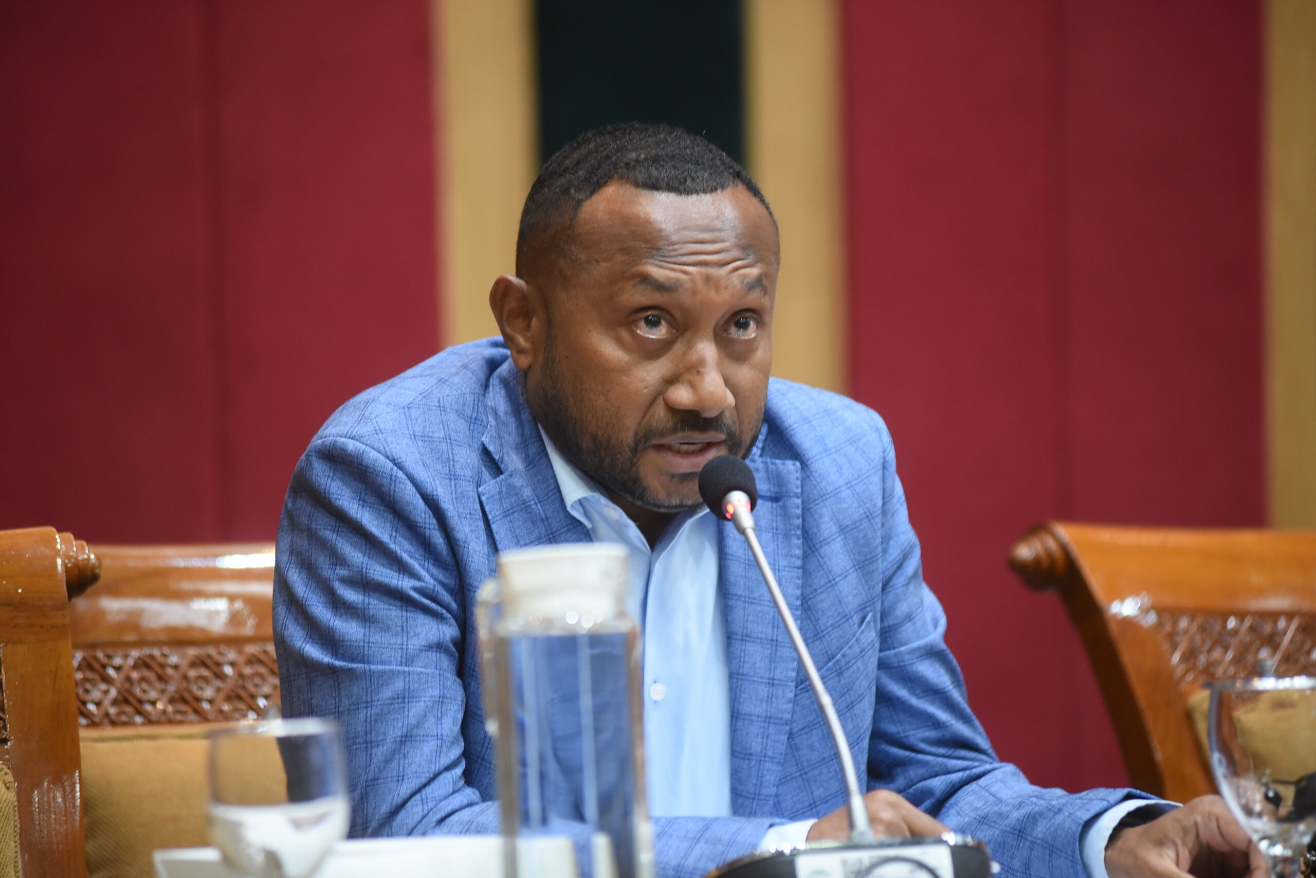 Anggota Komisi X DPR RI Yan Permenas Mandenas saat mengikuti pertemuan Rapat Kerja Komisi X DPR RI d20240605150534 scaled